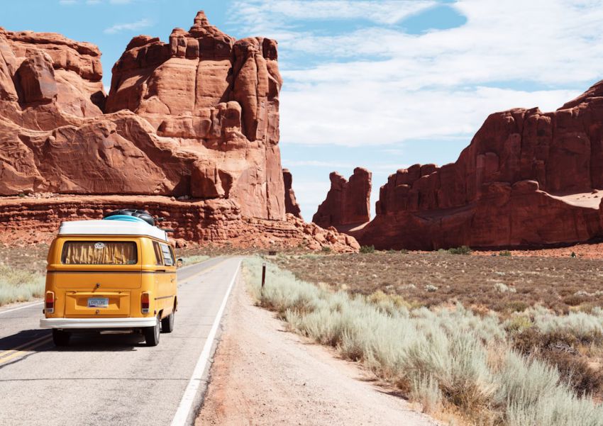 Travel - yellow Volkswagen van on road