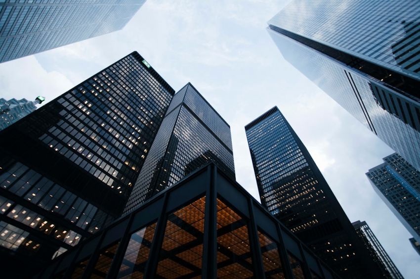 Investments - low angle photo of city high rise buildings during daytime