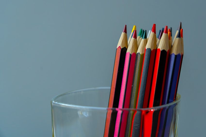 Tips - color pencils in clear drinking glass