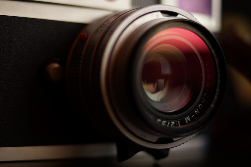 Manually - closeup photo of gray and black single-lens reflex camera