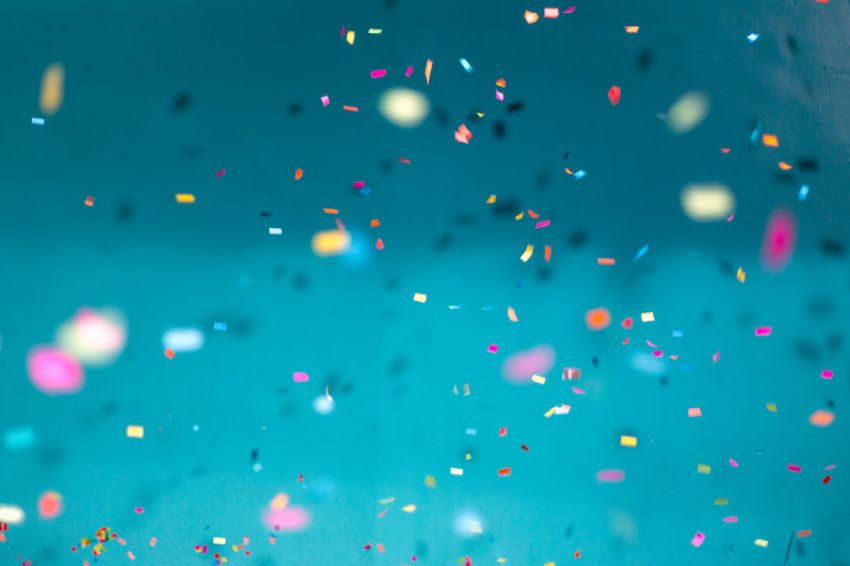 Anniversary - selective focus photography of multicolored confetti lot