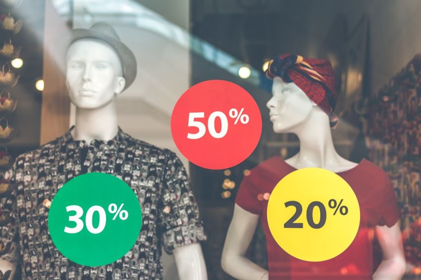 Discounts - two male and female mannequin wearing clothes